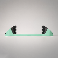 Giini Pyro Alpine Mint mechanical stomp pad, studio rear view showing the black bumpers