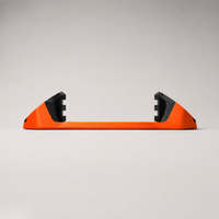 Giini Pyro Blaze Orange mechanical stomp pad, studio rear view showing the black bumpers