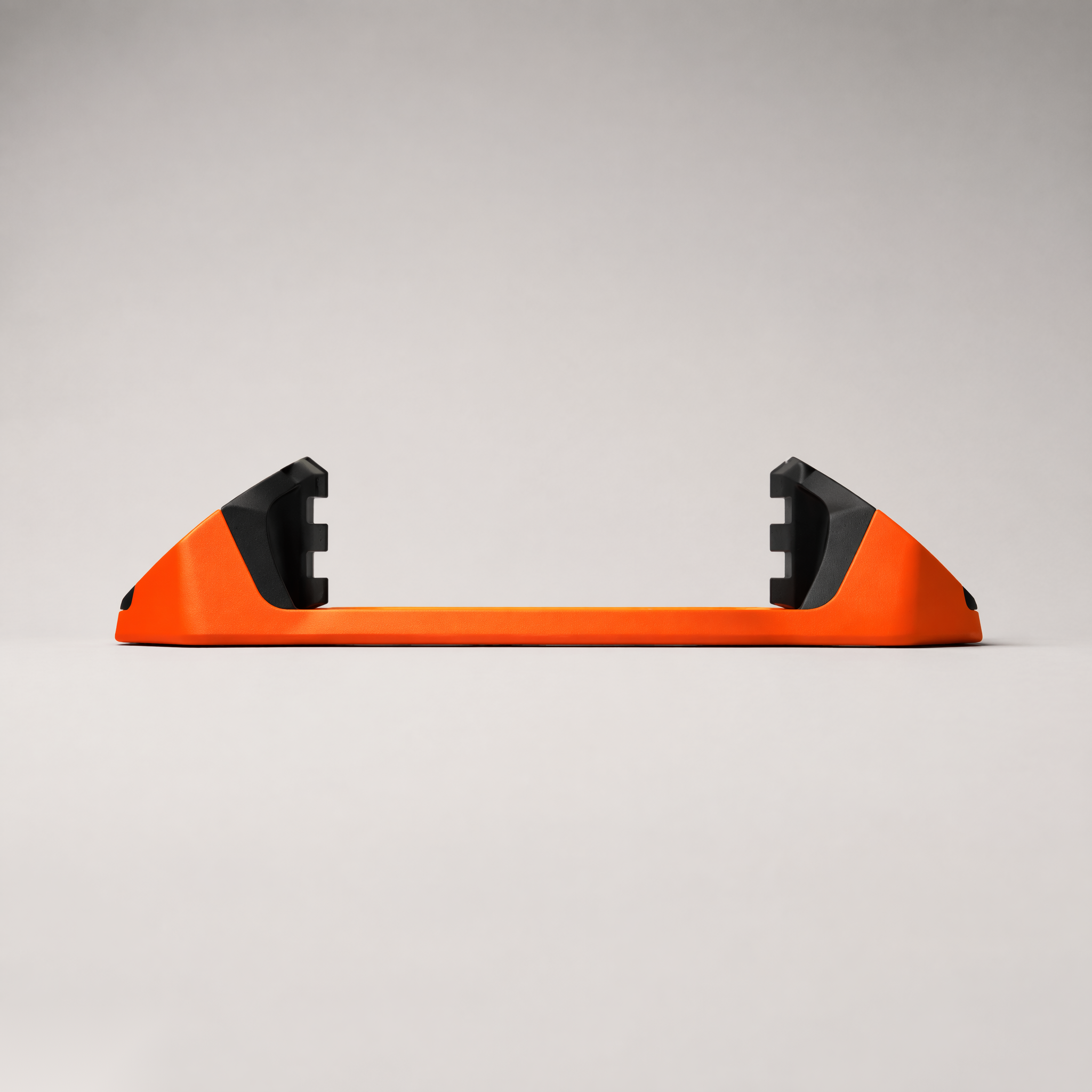 Giini Pyro Blaze Orange mechanical stomp pad, studio rear view showing the black bumpers