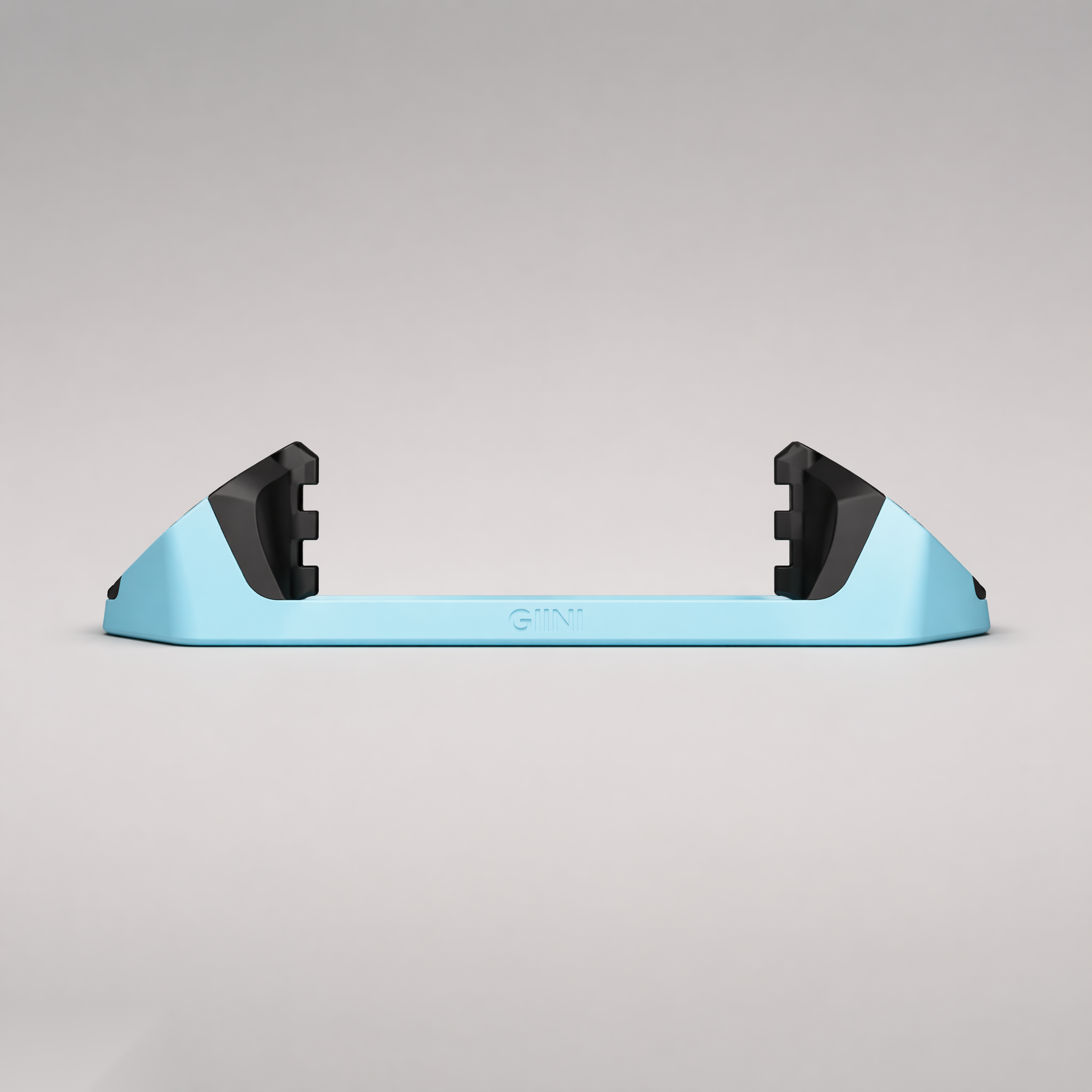 Giini Pyro Glacier Blue mechanical stomp pad, studio rear view showing the black bumpers