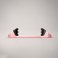 Giini Pyro Powder Pink mechanical stomp pad, studio rear view showing the black bumpers