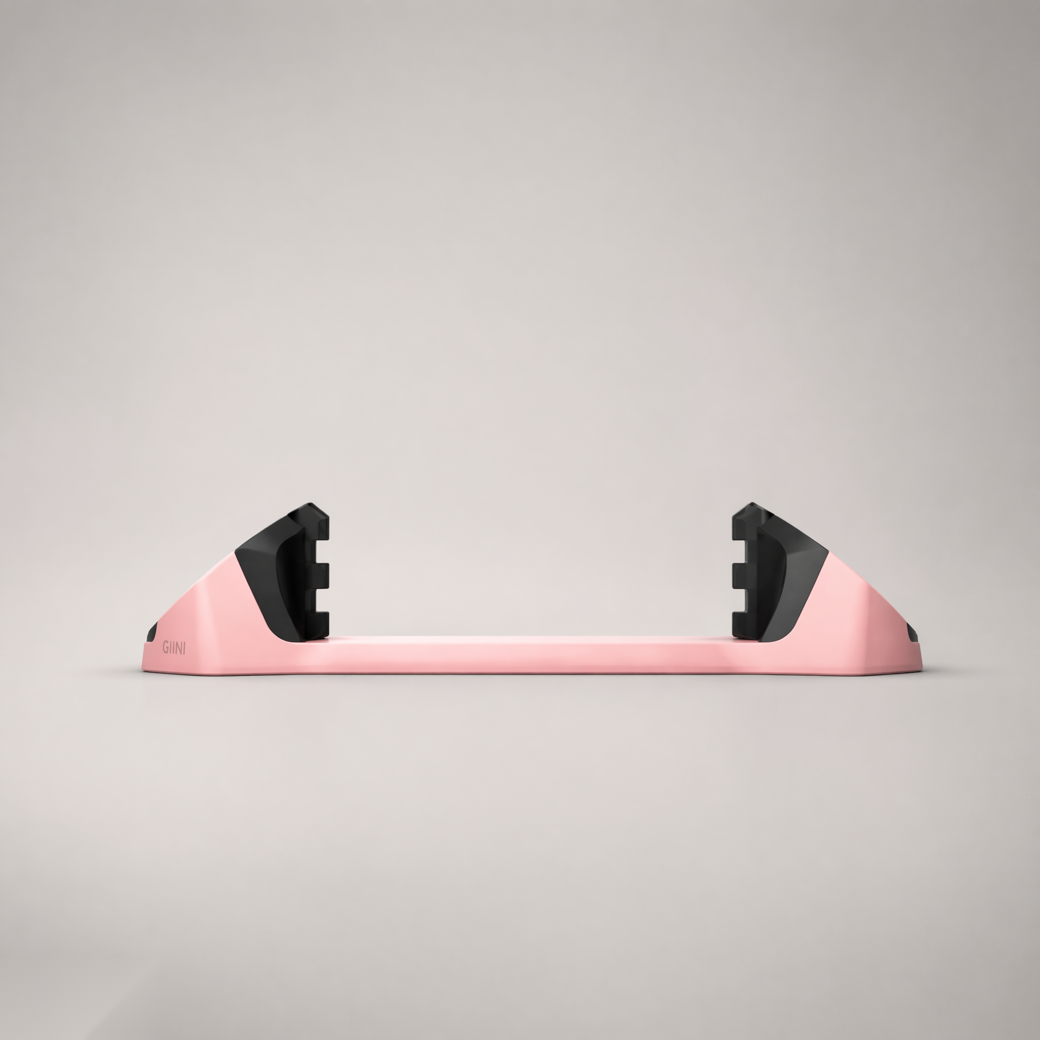 Giini Pyro Powder Pink mechanical stomp pad, studio rear view showing the black bumpers