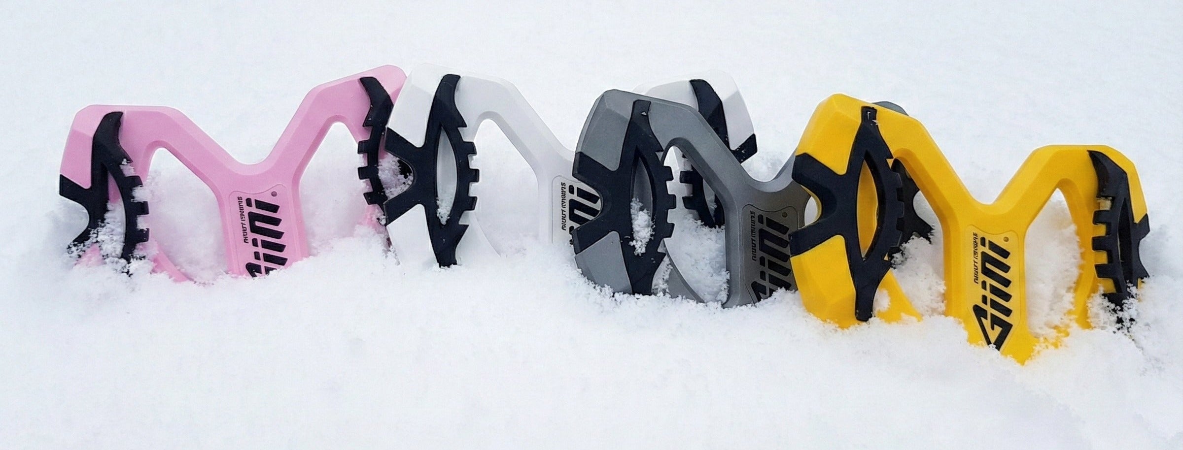 Giini Pyro lineup close-up in snow, all four colorways, cropped wide